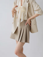 Load image into Gallery viewer, Pleated Flare Mini Skirt in Beige