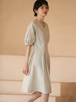 Load image into Gallery viewer, Blouson Pleat Tailored Dress in Greige
