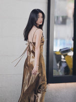 Load image into Gallery viewer, Metallic Tie Back Slip Dress in Gold
