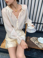 Load image into Gallery viewer, Sheer Flute Sleeve Button Blouse in White
