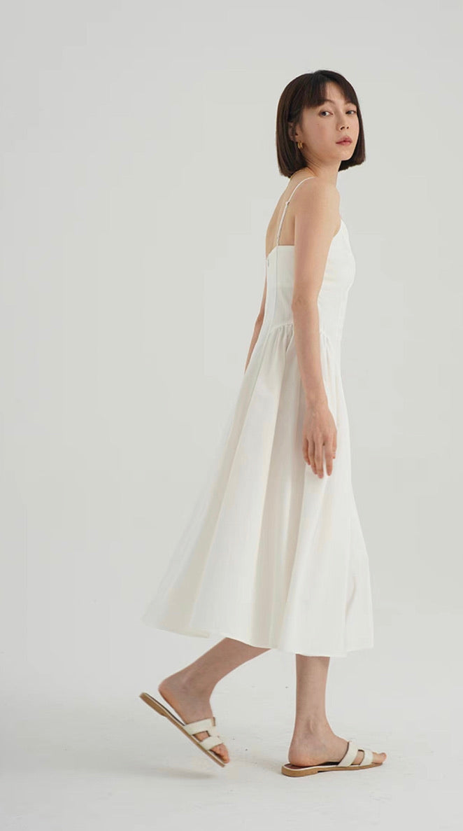 lexi white linen midi dress The Lexi Featuring a gathered bust and a shirred back, with pockets and a flowing body. The Lexi is the midi dress you'll style up and down, all year round.