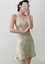 Load and play video in Gallery viewer, Tencel Blend Floral Sleeveless Mini Dress in Yellow
