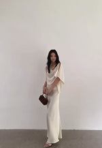 Load and play video in Gallery viewer, Satin Asymmetric Drape Top // Maxi Slip Skirt Set in Cream
