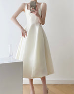 Load image into Gallery viewer, Sleeveless Flare Midi Dress in Cream

