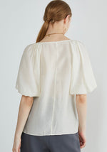 Load image into Gallery viewer, Tencel Blend Sheer Blouson Button Blouse in Cream
